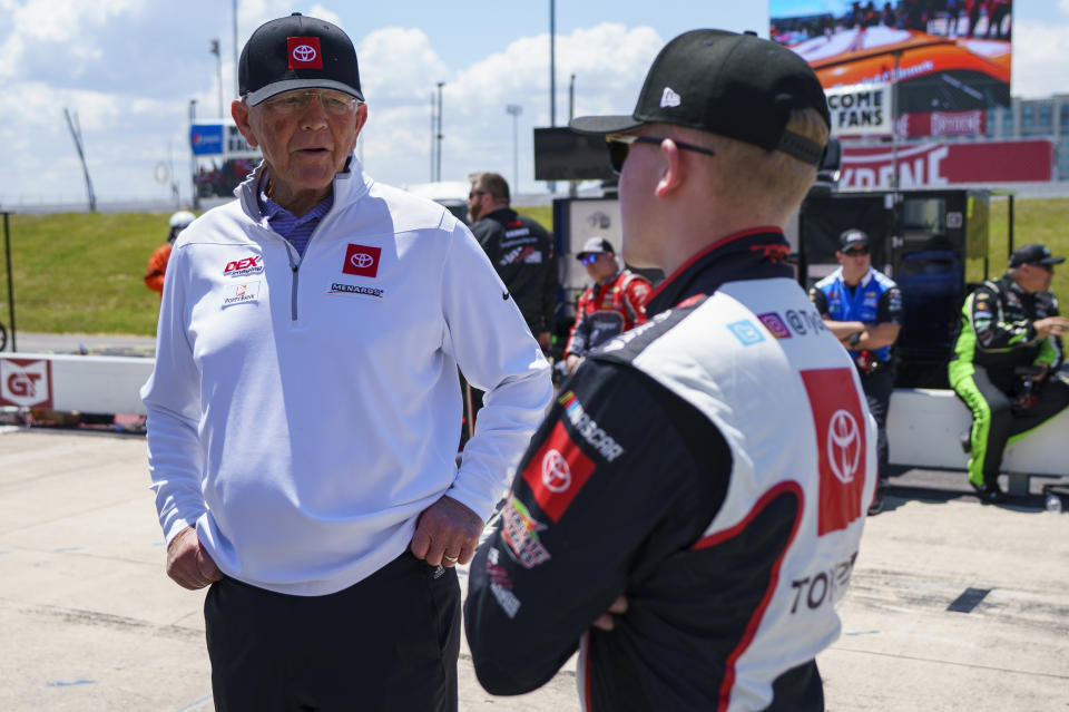 FILE - Joe Gibbs, left, talks things over with his grandson, Ty Gibbs, right, prior to a NASCAR Xfinity Series auto race at Dover International Speedway, Saturday, May 15, 2021, in Dover, Del. A week off might have been just what Ty Gibbs needed after consecutive races drew criticism for his aggressive driving and then a post-race fight with a rival. Now the 19-year-old grandson of Joe Gibbs heads to Talladega Superspeedway hoping to clear the slate. (AP Photo/Chris Szagola, File)