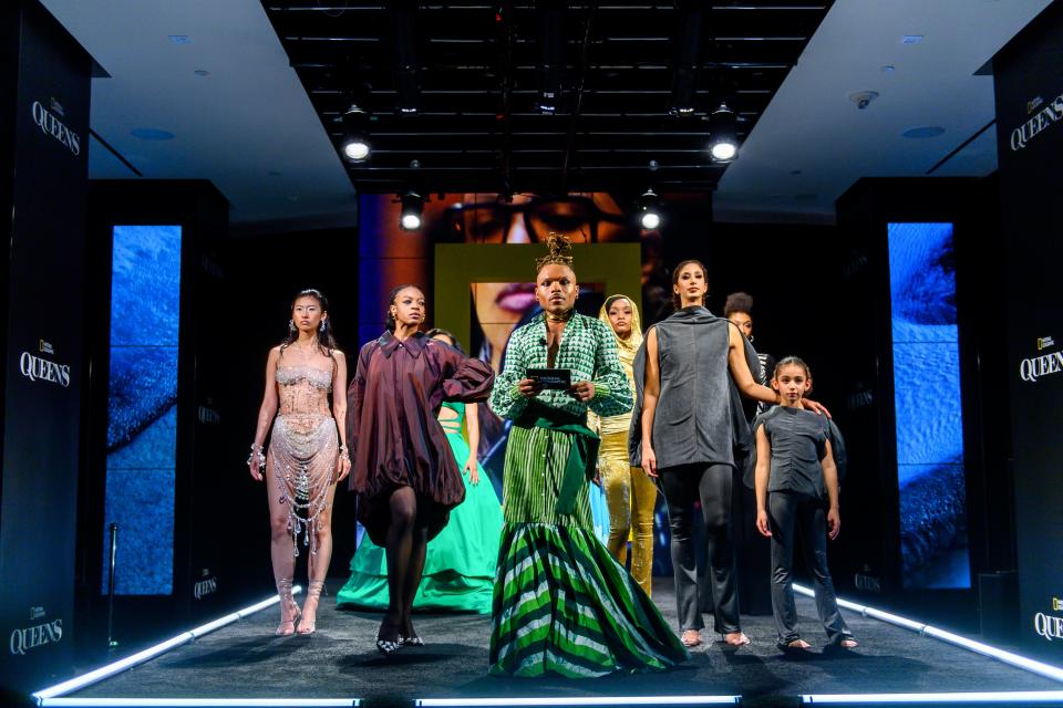 Host Christopher Griffin with the cast on stage during "Fit For A Queen" presented by Nat Geo during NYFW.