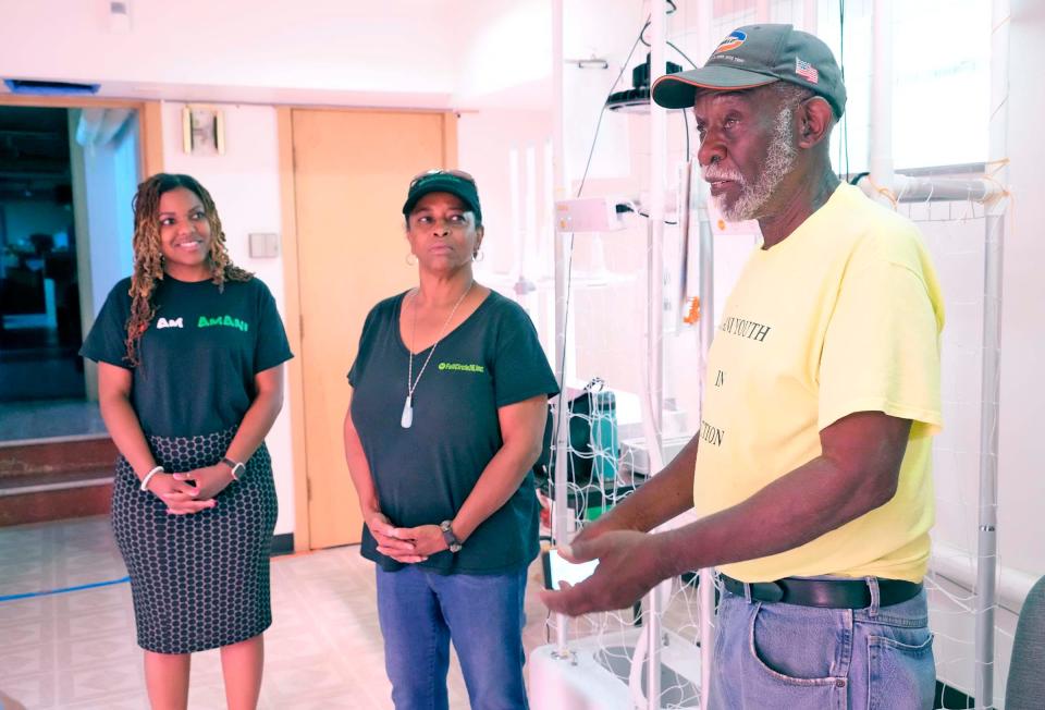 Dominican Center hydroponic specialist Wes Landry (right) explains how the hydroponic growing system works at the Dominican Center on June 22, 2023. The Dominican Center has an urban farm that it's planning to expand to help combat the Amani's neighborhood "food desert.”