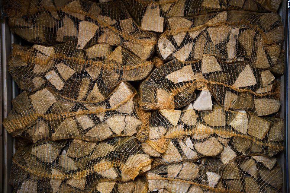 Firewood is storage in an apartment building in Berlin, Germany, Wednesday, Oct. 19, 2022. Europe's energy crisis, triggered by Russia slashing natural gas flows amid its war against Ukraine, has forced some people to turn to cheaper heating sources like firewood as the weather gets colder. But as more people stock up and burn wood fears are rising about the environmental impact of increased air pollution and tree-cutting. (AP Photo/Markus Schreiber)