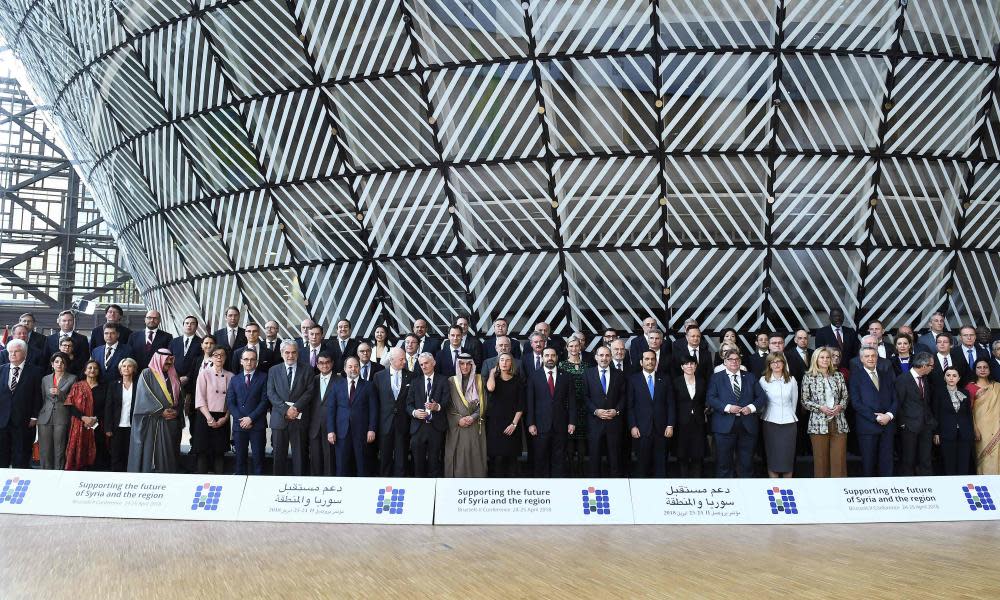 Participants pose during the conference in Brussels on 25 April.