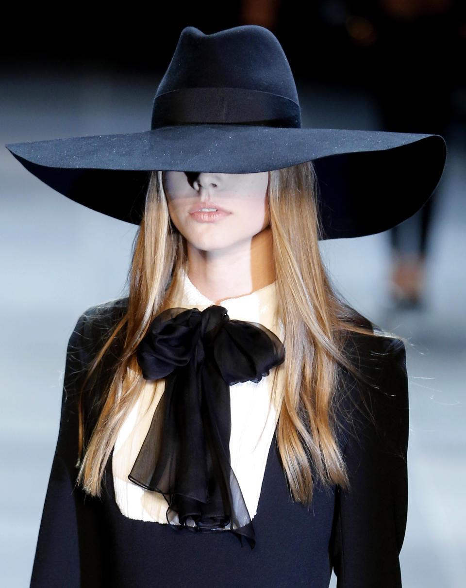 A model wears a creation by French born fashion designer Hedi Slimane for Saint Laurent ready to wear Spring-Summer 2013 collection, presented in Paris, Monday, Oct. 1, 2012. (AP Photo/Jacques Brinon)