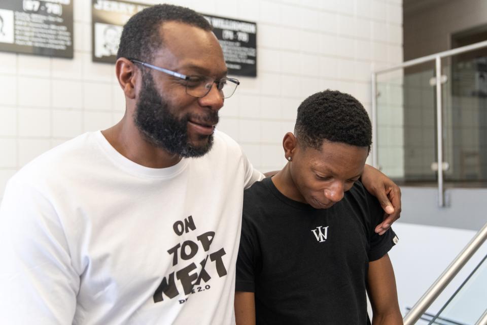 New Mexico State basketball star William Benjamin (left) hugs his son, Duece Benjamin (right), at Pan American Center on Tuesday, April 26, 2022. Duece will join New Mexico State’s basketball team next spring, following his father’s footsteps. 