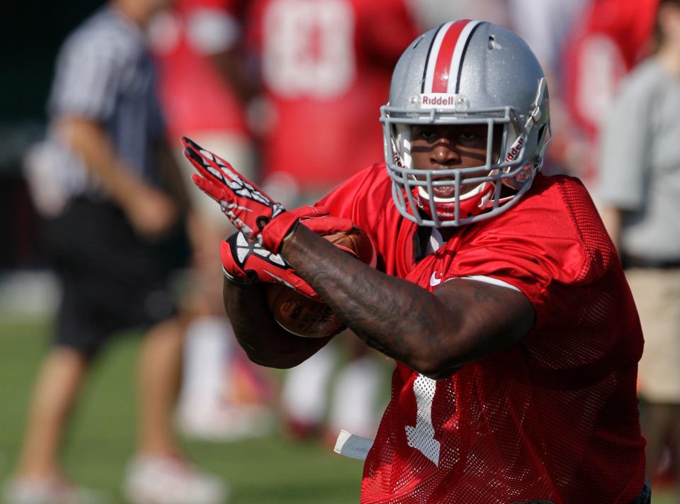 FILE - In this Aug. 9, 2014, file photo, Ohio State running back Rod Smith carries the ball during an NCAA college football practice in Columbus, Ohio. Rod Smith has left the Ohio State team to “deal with some personal issues.” Head coach Urban Meyer confirmed the speculated move on Tuesday, Oct. 28, 2014,  in an email.(AP Photo/Jay LaPrete, File)