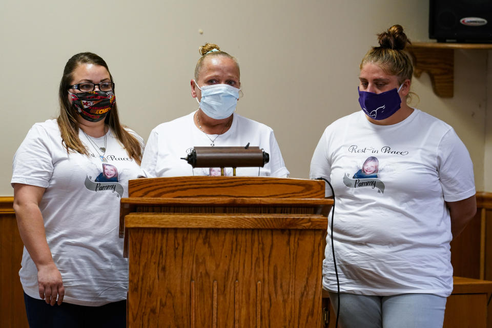 Cherri West, center, is joined by her daughter Terri West, left, and granddaughter Angelica West after witnessing the execution of her daughter's killer Keith Dwayne Nelson at the federal prison complex in Terre Haute, Ind., Friday, Aug. 28, 2020. Nelson, who was convicted of kidnapping, raping and murdering at 10-year-old Kansas girl, was executed and pronounced death at 4:32pm. (AP Photo/Michael Conroy)
