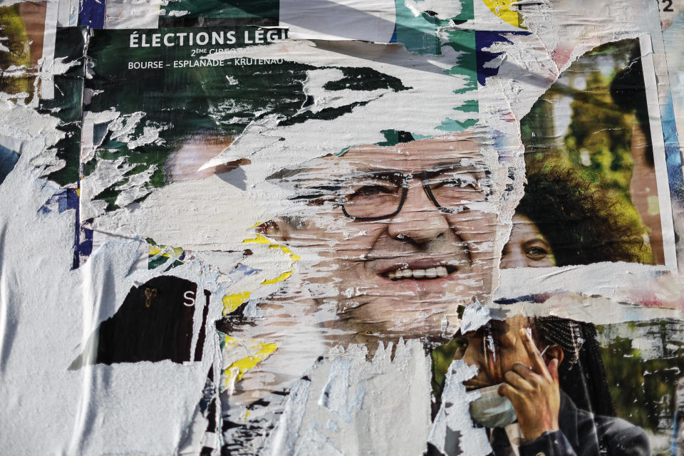 A view of an election poster for the upcoming parliamentary election with the face of Jean-Luc Melenchon, the leader of the far left opposition party, in Strasbourg, eastern France, Thursday, June 9, 2022. Leftist parties that nearly disappeared from the French political landscape have grown wings in the run-up to Sunday’s legislative elections and now threaten to weaken President Emmanuel Macron, and his hopes of slam-dunking his own agenda through parliament. (AP Photo/Jean-Francois Badias)