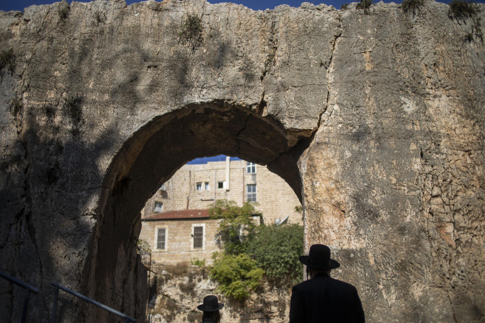 In this Thursday, Oct. 31, 2019 photo, ultra-Orthodox Jews visits the Tomb of the Kings, a large underground burial complex dating to the first century BC, in east Jerusalem neighborhood of Sheikh Jarrah. After several aborted attempts, the French Consulate General has reopened one of Jerusalem's most magnificent ancient tombs to the public for the first time in over a decade, sparking a distinctly Jerusalem conflict over access to an archaeological-cum-holy site in the volatile city's eastern half. (AP Photo/Ariel Schalit)