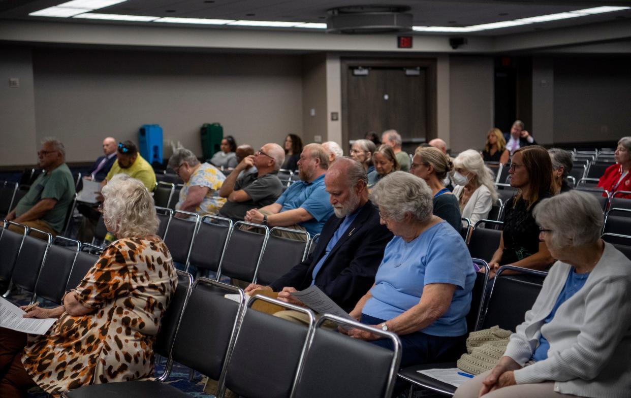 People gather to address the Indiana Utility Regulatory Commission during a hearing to receive public comments on the latest CenterPoint rate increase request at the Old National Events Plaza in Evansville, Ind., Wednesday, Sept. 13, 2023.