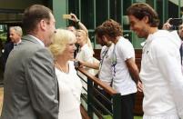 Britain's Camilla, Duchess of Cornwall stands with AELTC Chairman Philip Brook, as she chats with Rafael Nadal of Spain, during her visit to the Wimbledon Tennis Championships in London, Britain July 2, 2015. REUTERS/Dominic Lipinski/Pool -