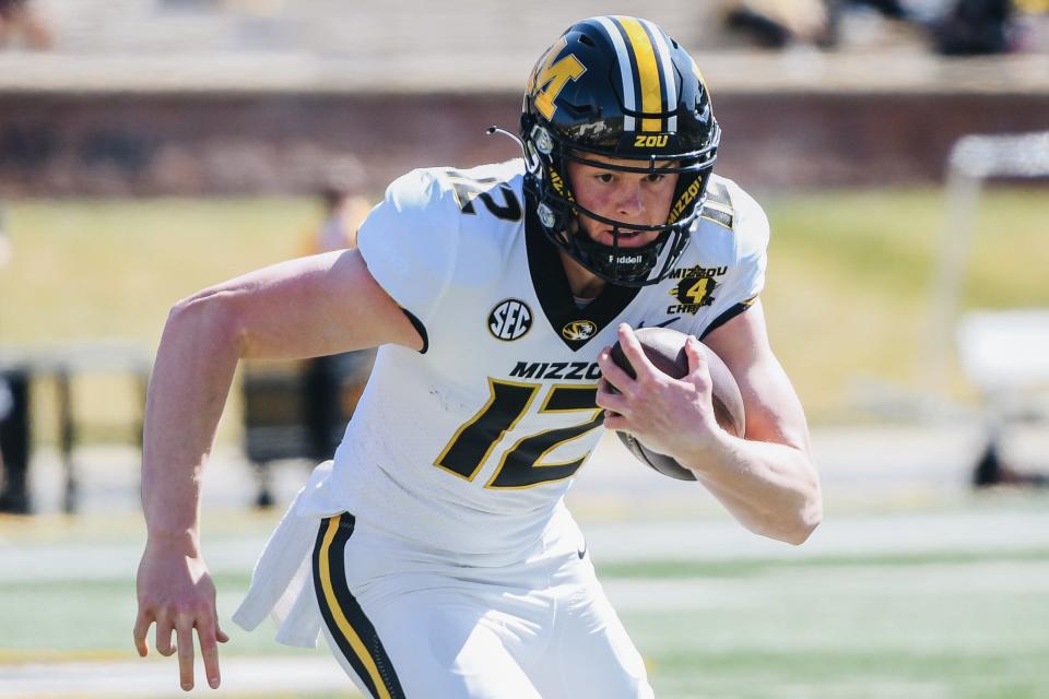 Missouri quarterback Brady Cook carries the ball during the Tigers' spring game in 2021.