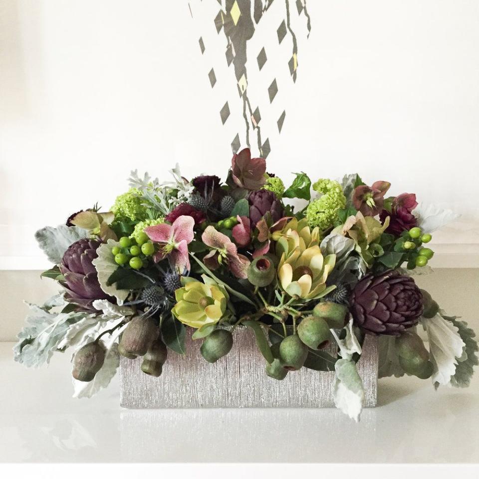 <p>For the decorator who wants to make a big statement in an understated way, follow this centerpiece’s formula. Though the flowers are in a subdued palette, the arrangement is energized by the thistle, hypericum, artichokes, and, most notably, eucalyptus pods. </p><p><em>Via <a href="http://www.darlingtonavenue.com" rel="nofollow noopener" target="_blank" data-ylk="slk:Darlington Avenue;elm:context_link;itc:0;sec:content-canvas" class="link ">Darlington Avenue</a> </em></p>