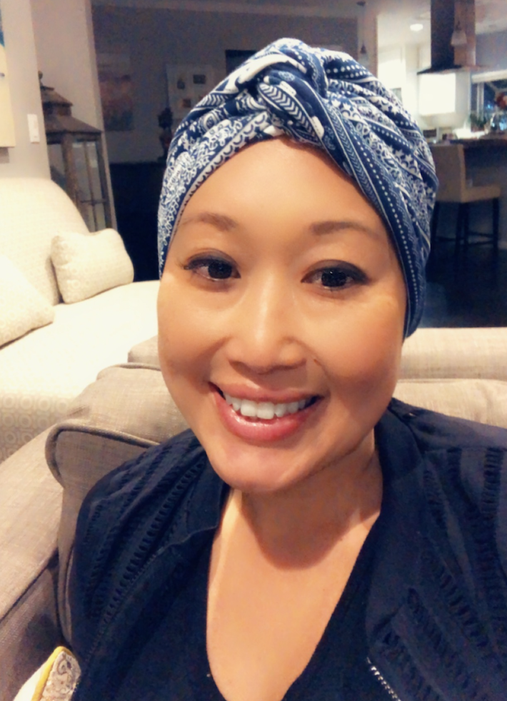 The author wearing one of her signature turbans, post-chemo