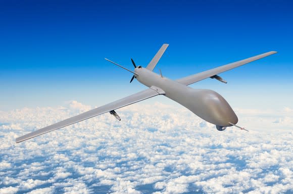 An unmanned aerial vehicle flies above the clouds.