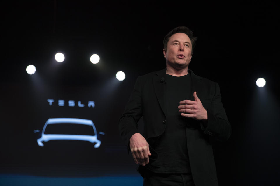 Tesla CEO Elon Musk speaks before unveiling the Model Y at the company's design studio Thursday, March 14, 2019, in Hawthorne, Calif. (AP Photo/Jae C. Hong)