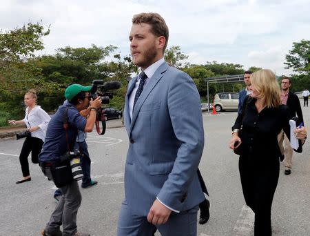 Jack Walker, one of the nine Australian men who were detained for stripping down to their underwear at last Sunday's Formula One Malaysian Grand Prix, leaves the Magistrate Court in Sepang, Malaysia October 6, 2016. REUTERS/Lai Seng Sin