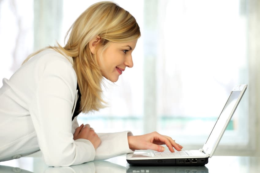 Woman typing on laptop computer