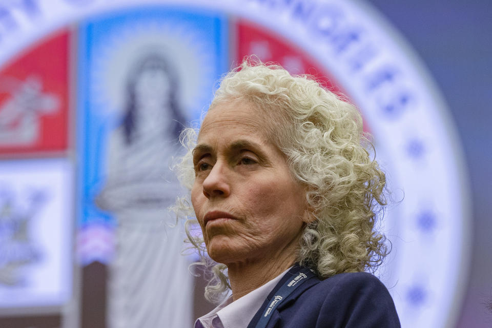 FILE - In this March, 12, 2020, file photo, Los Angeles County Public Health Director Barbara Ferrer takes questions at a news conference in Los Angeles. California has stopped updating a list of counties facing more restrictions on businesses and schools after a problem in the state's coronavirus testing database has led to an undercount. (AP Photo/Damian Dovarganes, File)