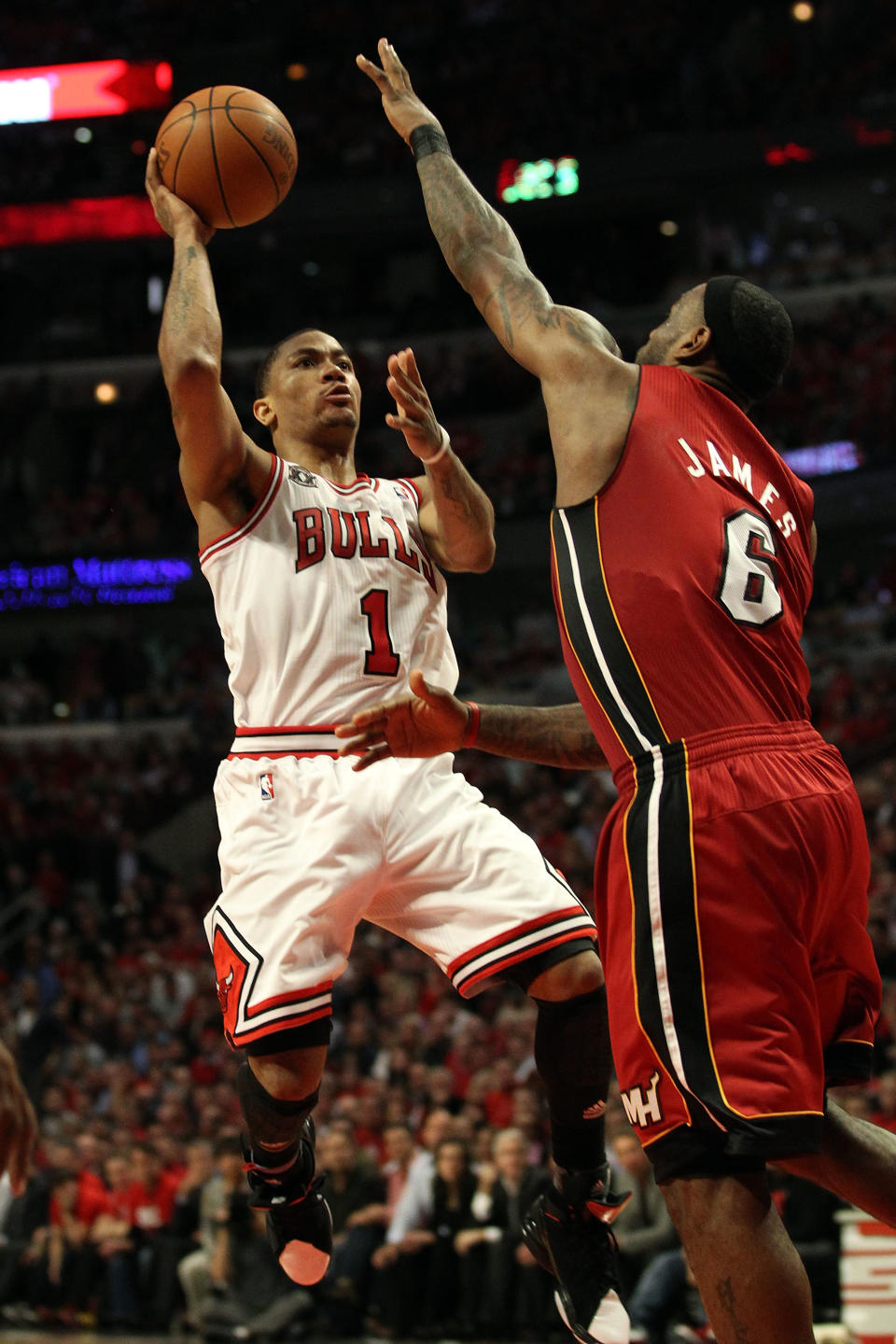 CHICAGO, IL - MAY 26: Derrick Rose #1 of the Chicago Bulls drives for a shot attempt against LeBron James #6 of the Miami Heat in Game Five of the Eastern Conference Finals during the 2011 NBA Playoffs on May 26, 2011 at the United Center in Chicago, Illinois. NOTE TO USER: User expressly acknowledges and agrees that, by downloading and or using this photograph, User is consenting to the terms and conditions of the Getty Images License Agreement. (Photo by Jonathan Daniel/Getty Images)