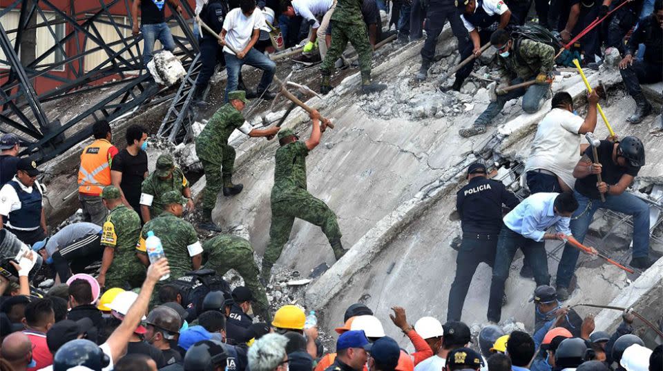 Rescuers worked throughout the night in search of survivors in Mexico. Source: AP