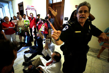 Healthcare activists protest to stop the Republican health care bill at Russell Senate Office Building on Capitol Hill. REUTERS/Yuri Gripas