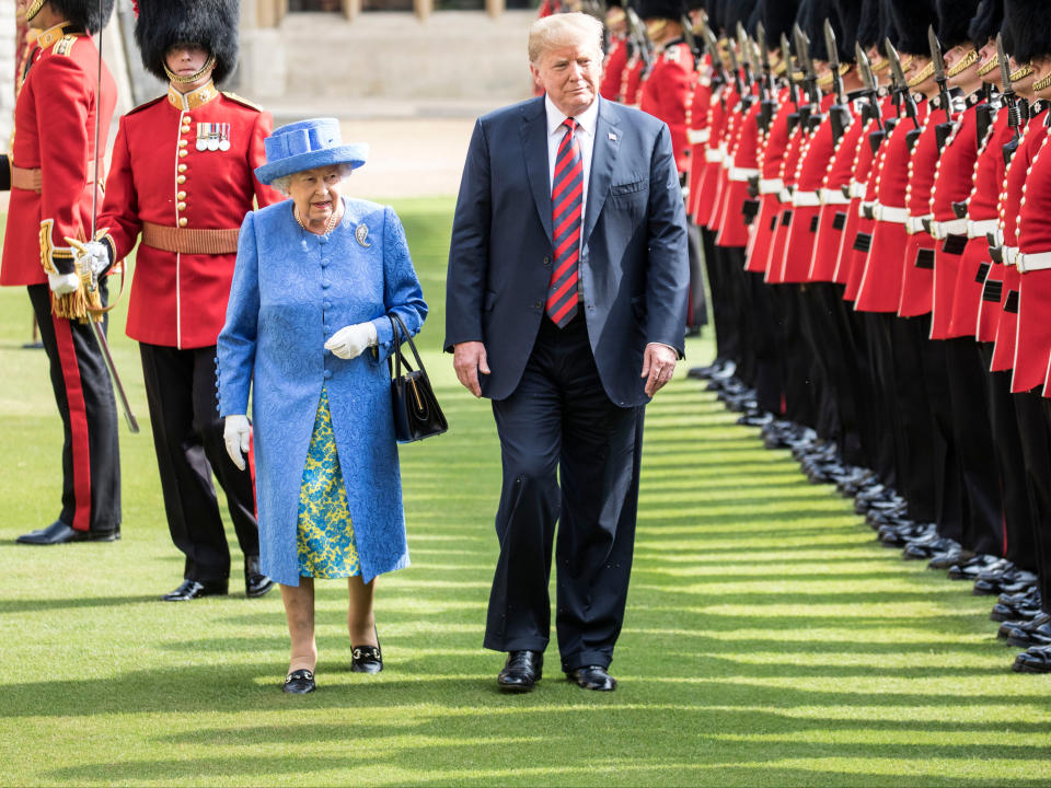 Donald Trump and Britain’s Queen Elizabeth II inspect a Guard of Honour, formed of the Coldstream Guards at Windsor Castle, 13 July 2018Getty Images
