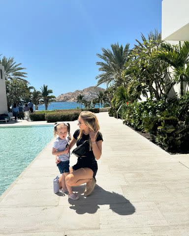 <p>Brittany Mahomes/Instagram</p> Brittany Mahomes posing with her daughter at Chileno Bay Club.