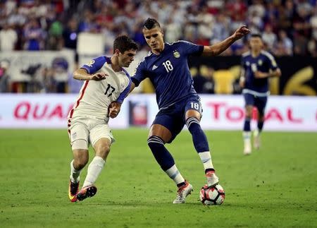 Jun 21, 2016; Houston, TX, USA; Argentina forward Erik Lamela (18) dribbles the ball as United States midfielder Christian Pulisic (17) defends during the second half in the semifinals of the 2016 Copa America Centenario soccer tournament at NRG Stadium. Kevin Jairaj-USA TODAY Sports