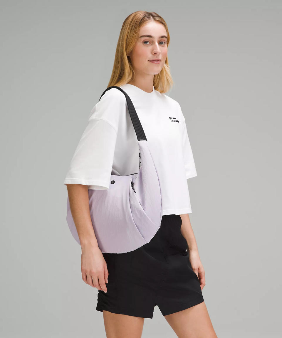 someone wearing the Pleated Shoulder Bag 10L from Lululemon