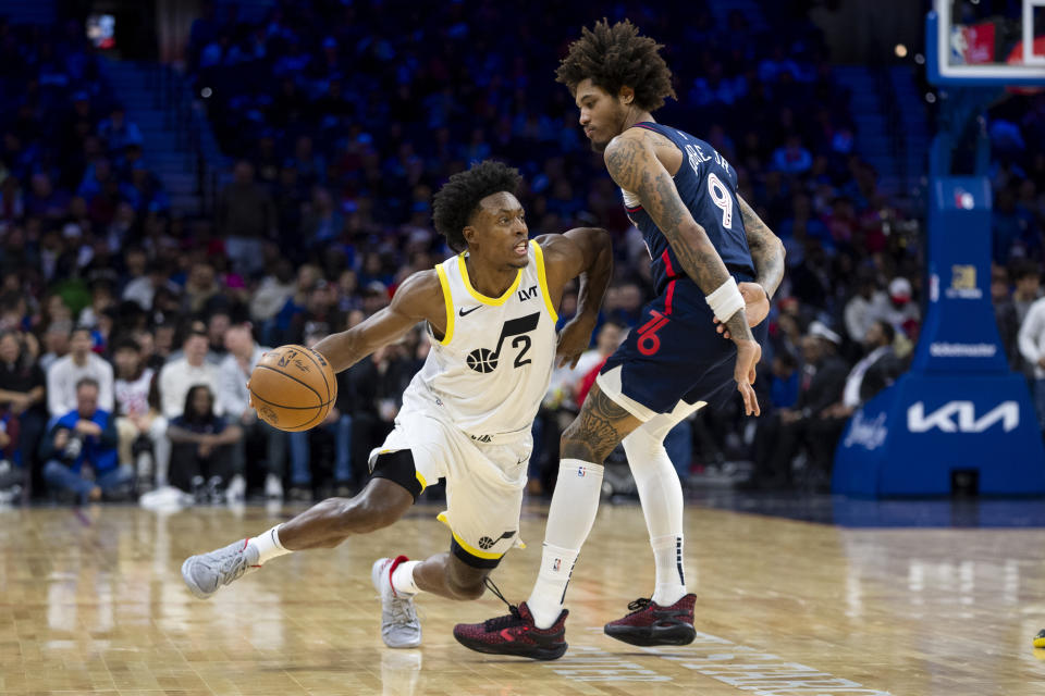 Utah Jazz's Collin Sexton, left, drives against Philadelphia 76ers' Kelly Oubre Jr. during the second half of an NBA basketball game Saturday, Jan. 6, 2024, in Philadelphia. The Jazz won 120-109. (AP Photo/Chris Szagola)