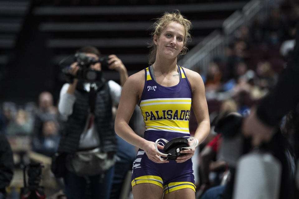 Palisades' Savannah Witt, walks off the mat after winning her first found match at PIAA High School Wrestling Championships in Hershey, Pa., Thursday, March 7, 2024. Girls’ wrestling has become the fastest-growing high school sport in the country. (AP Photo/Matt Rourke)