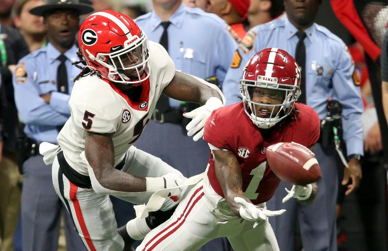 Dec 4, 2021; Atlanta, GA, USA; Georgia defensive back Kelee Ringo (5) defends a pass to Alabama wide receiver Jameson Williams (1) which fell incomplete during the SEC championship game at Mercedes-Benz Stadium. Mandatory Credit: Gary Cosby Jr.-USA TODAY Sports