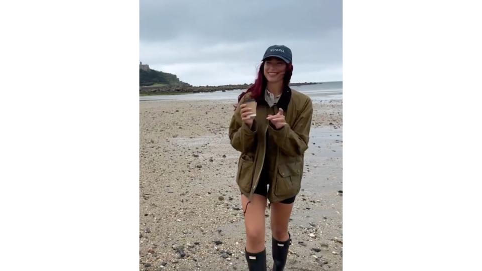 Dua lipa posts a video of herself in Wellington boots while at a UK beach