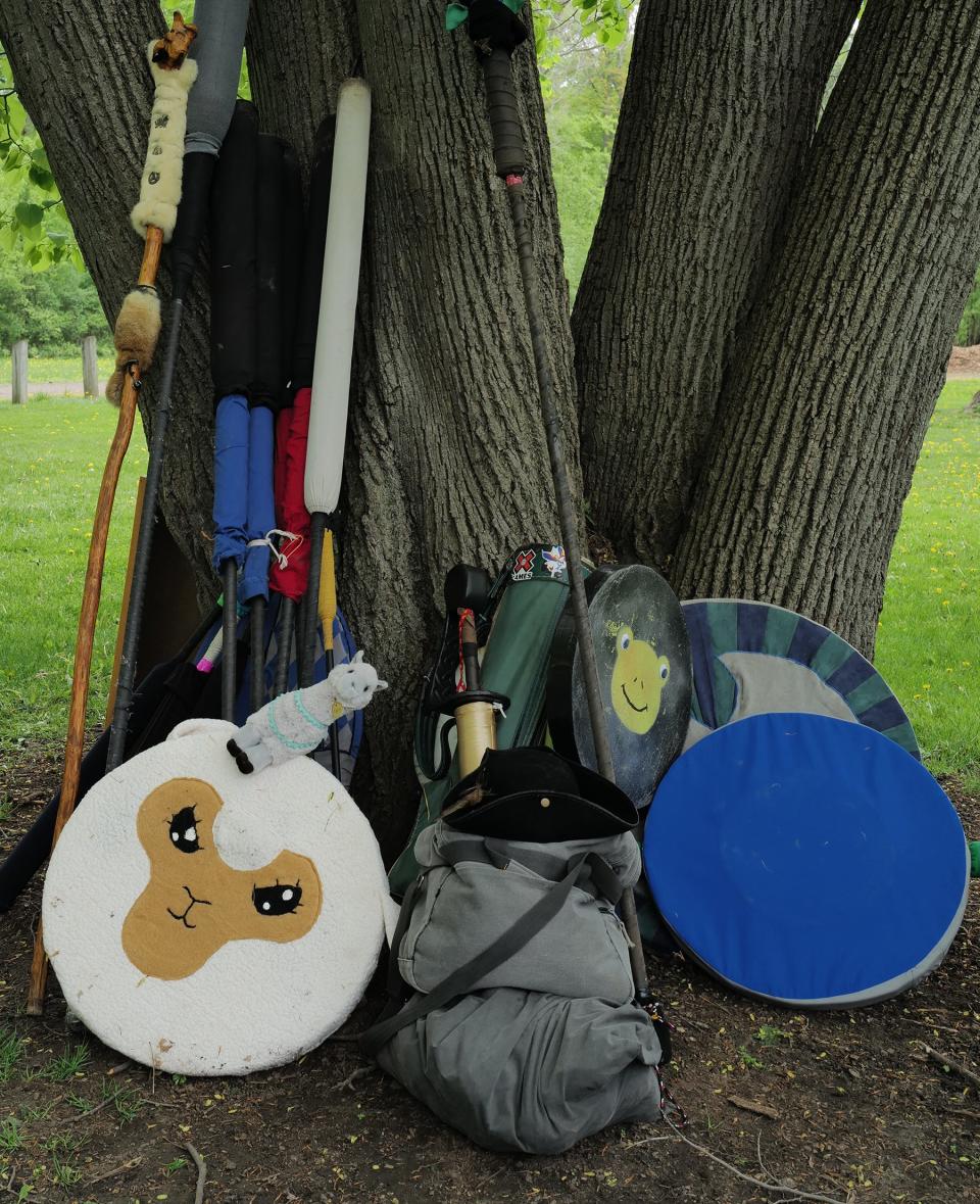 An array of weapons and medieval garb, all handmade, ready for people interested in trying out the fantasy game Amtgard at Patriarche Park Sunday, May 15, 2022. The Ashen Hills group meets Sundays at 1 p.m.