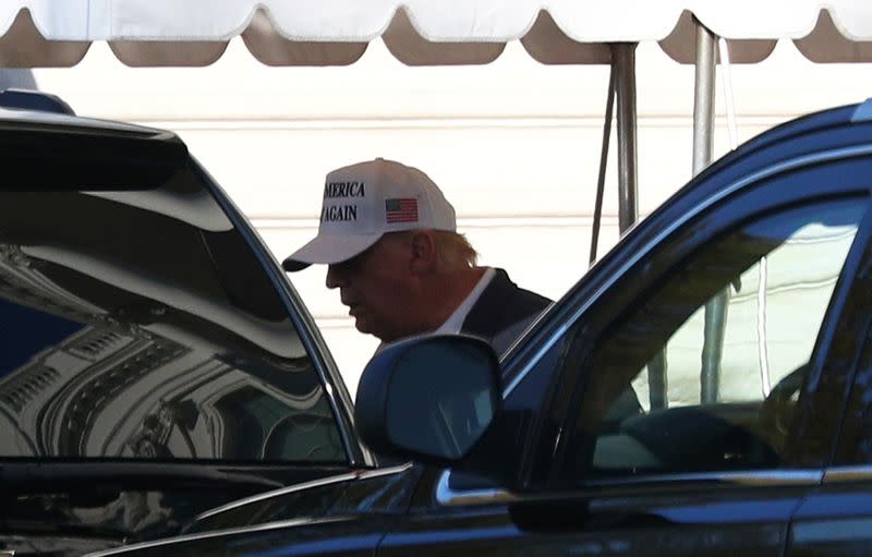 U.S. President Donald Trump enters the Presidential motorcade before traveling to an undisclosed location at the south portico of the White House in Washington