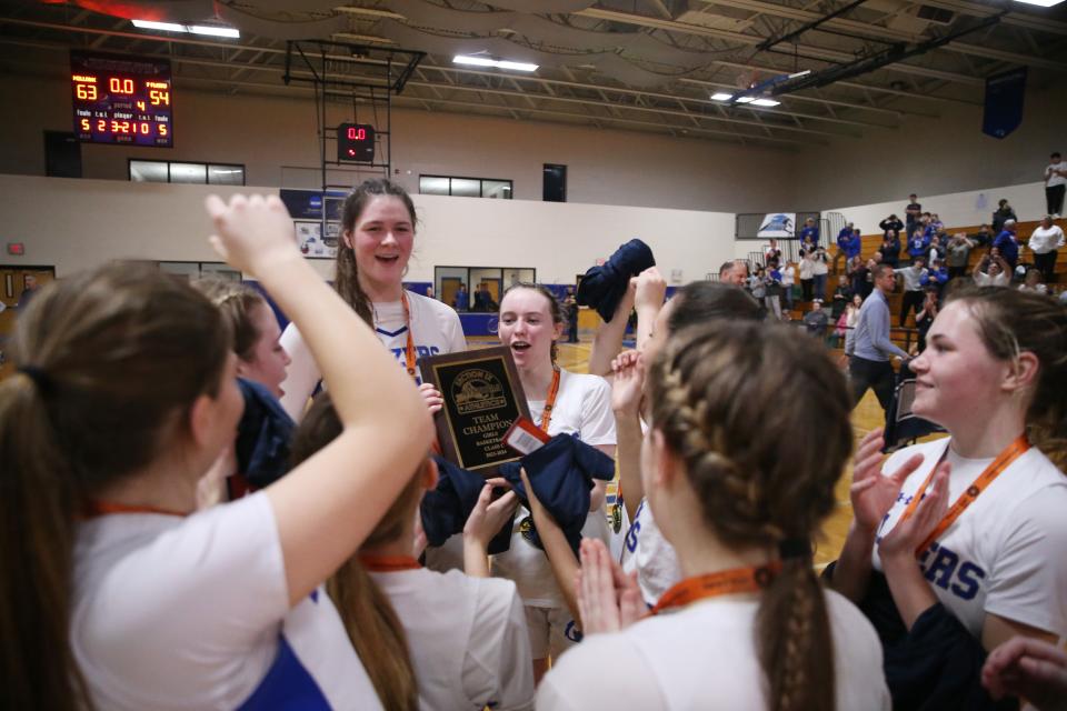Millbrook's girls basketball team celebrate winning the Section 9 Class C girls basketball championship versus Pine Plains on February 28, 2024.