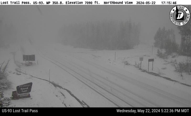 A traffic webcam shows snow at Lost Trail Pass late afternoon on May 22, 2024. (Idaho DOT)