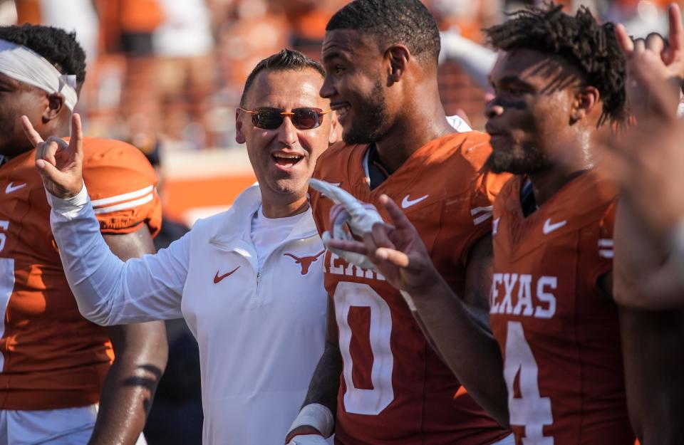 Texas football coach Steve Sarkisian leads a Longhorns contingent of quarterback Quinn Ewers, left tackle Kelvin Banks Jr. and defensive back Jahdae Barron into Wednesday's first SEC media days for UT.