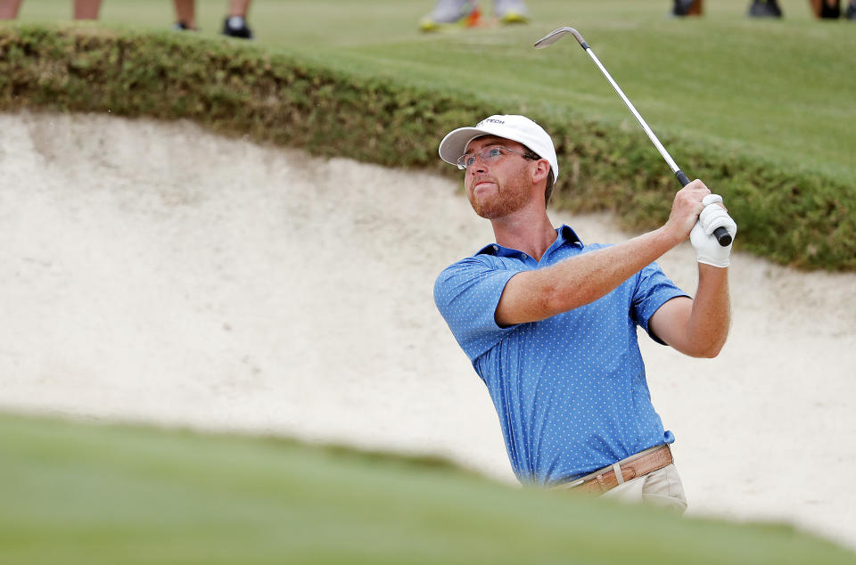 Andy Ogletree eyes his shot from a bunker during the final round against John Augenstein at the USGA Amateur Golf Championship at the Pinehurst Country Club , in Pinehurst, N.C, Sunday, Aug. 18, 2019, (AP Photo/Karl B DeBlaker)