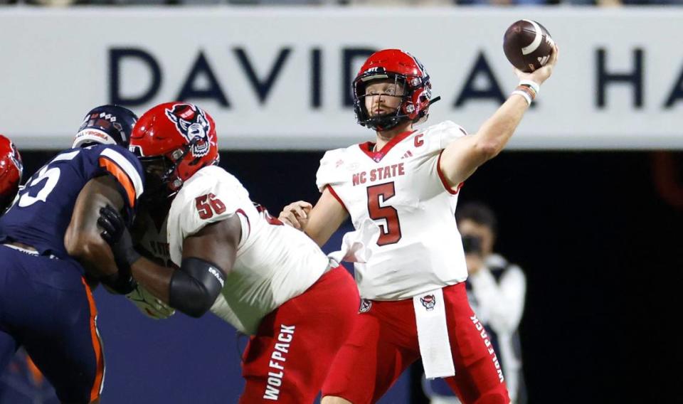 N.C. State quarterback Brennan Armstrong (5) throws during the first half of N.C. State’s game against Virginia at Scott Stadium in Charlottesville, Va., Friday, Sept. 22, 2023.