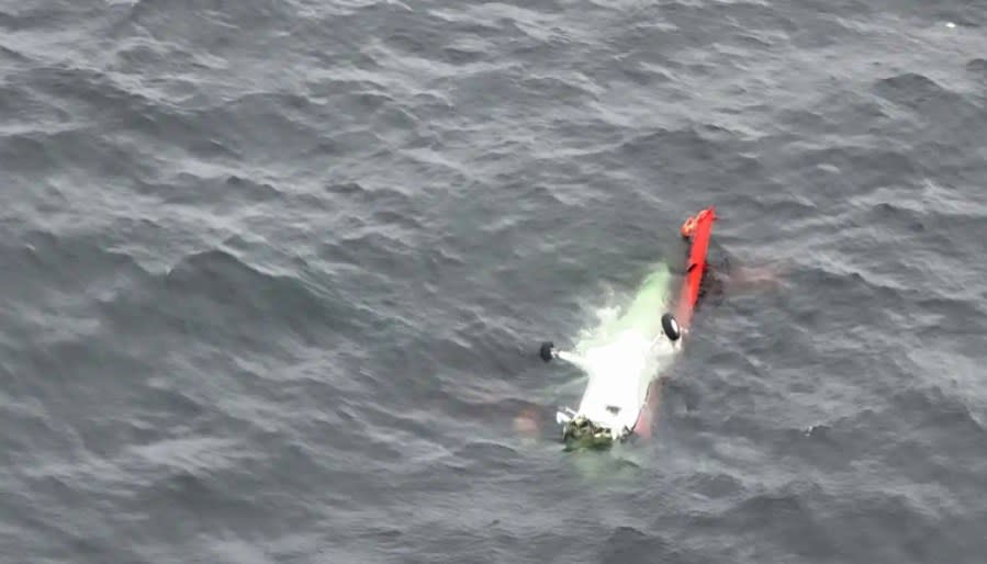 Plane crash wreckage is seen in the Pacific Ocean on May 20, 2023. (Image courtesy U.S. Coast Guard)