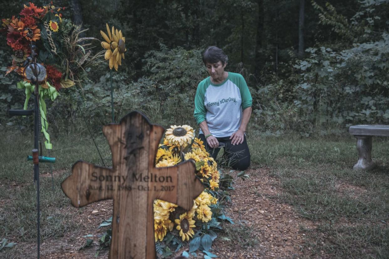 Image: Susan Melton sits by her son Sonny's final resting place at his home in Big Sandy