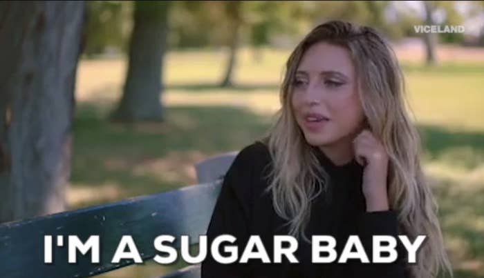 Woman sitting on a park bench in "Slutever" saying: "I'm a sugar baby"