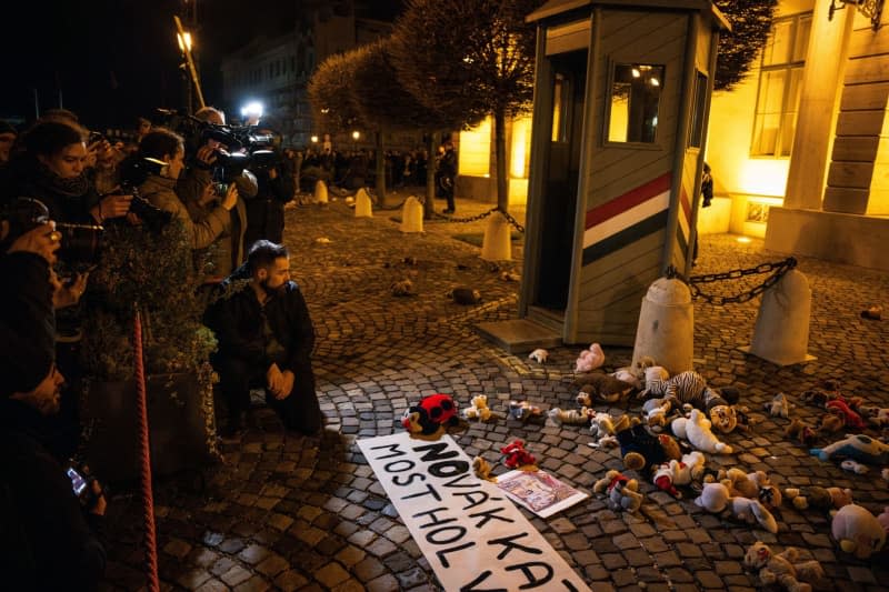 Protesters lay down stuffed animals during a protest against Hungarian President Katalin Novak decision to pardon a man in a case of child sexual abuse. Marton Monus/dpa