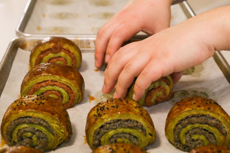 Kristine Jingozian puts nazook pastries on a larger separate tray.