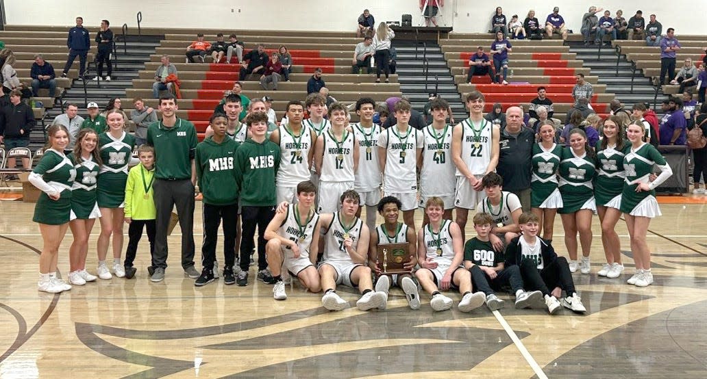 The Malvern High School boys basketball team poses for a photo after winning a 2024 Division III district title.