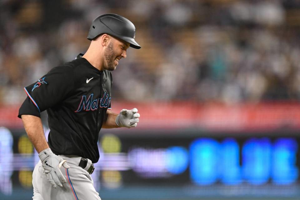 Aug 18, 2023; Los Angeles, California, USA; Miami Marlins catcher Jacob Stallings (58) hits a home run against the Los Angeles Dodgers during the third inning at Dodger Stadium.