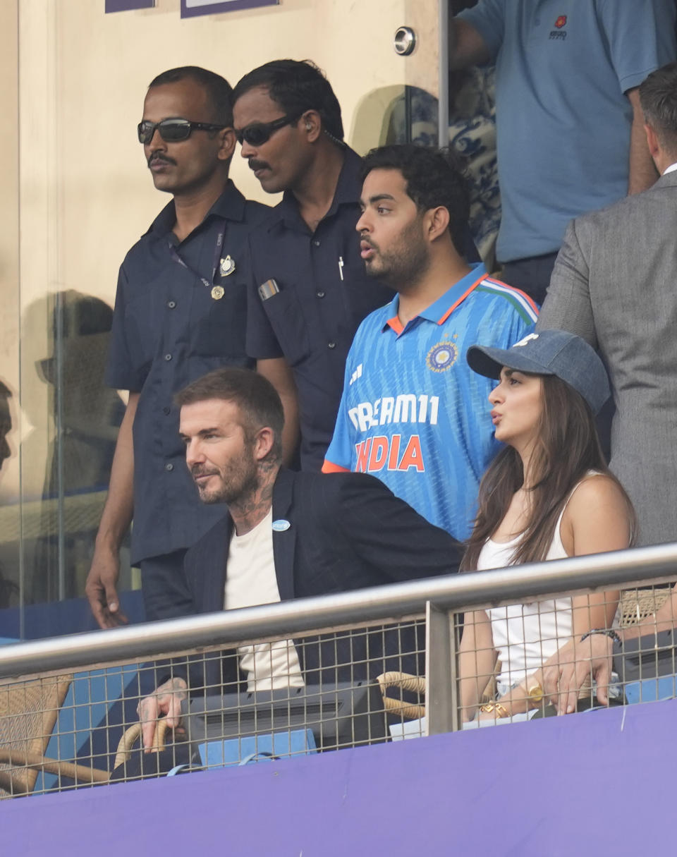 Former soccer star David Beckham Bollywood actor Kira Adani and Akash Ambani watch the ICC Men's Cricket World Cup first semifinal match between India and New Zealand in Mumbai, India, Wednesday, Nov. 15, 2023. (AP Photo/Rafiq Maqbool)