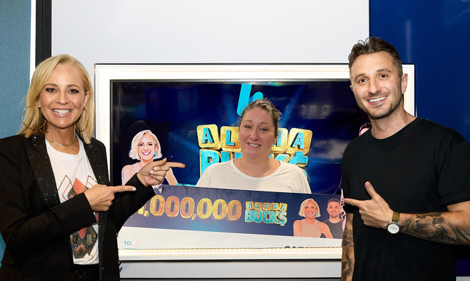 Carrie Bickmore and Tommy Little with listener Stacey who won The Hit Network’s $1,000,000 Alphabucks with Carrie and Tommy. Photo: supplied.