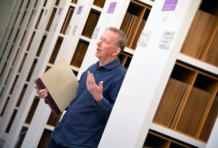 Andy Linehan, Curator of Popular Music Recordings at the British Library, holds an example of a record album - a collection of 78rpm vinyl record classical recordings from the 1930's - which forms part of the musical collection of over 250 000 pieces at the British Library in London, Britain, June 15, 2018. Picture taken June 15, 2018. REUTERS/Toby Melville