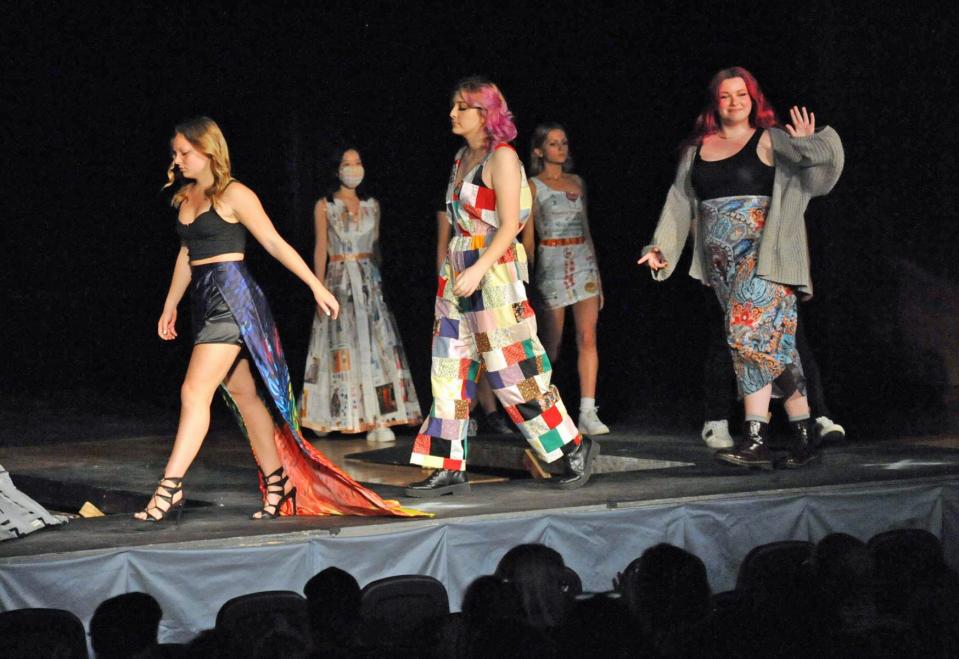 A group of Quincy High School student models walk the runway  during the Quincy High School Fashion Show, Thursday, May 12, 2022.